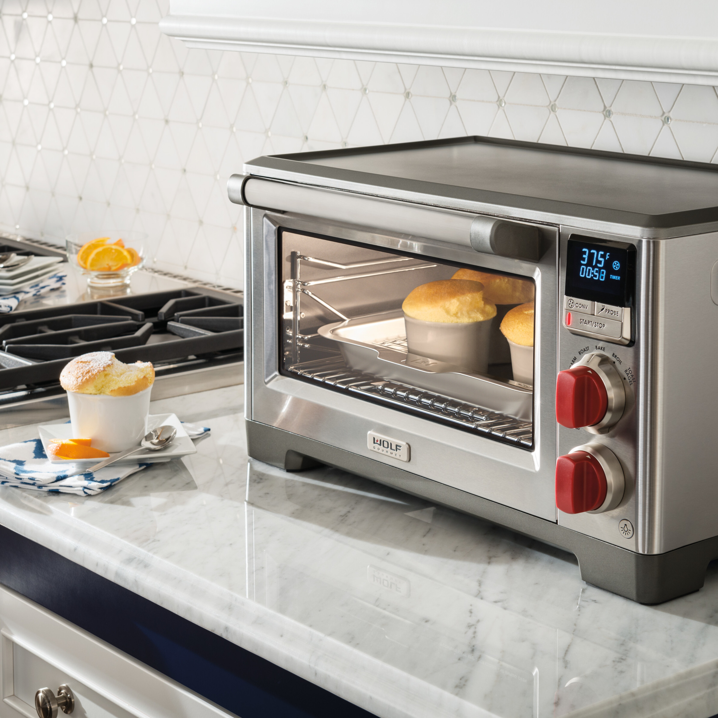 Wolf Gourmet Countertop Oven on counter with souflees baking.